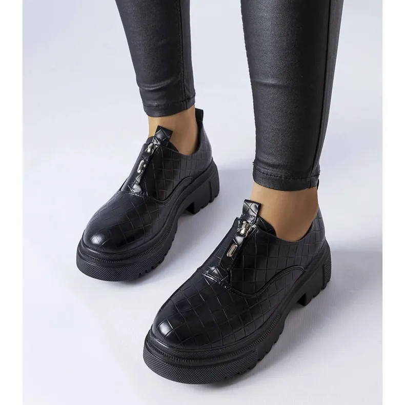 Brogues noires avec gaufrage de Travers le noir